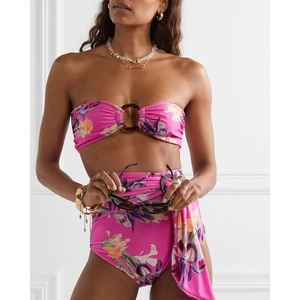 Detail of floral fuchsia bikini set with tortoiseshell ring and sarong tie detail