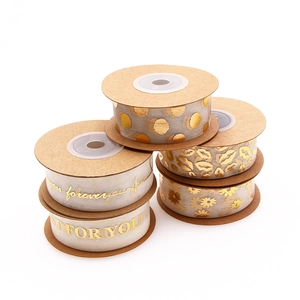 Sheer gold foil ribbons with dots, lips, and floral patterns for gift wrapping