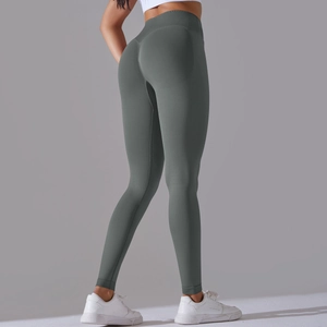 Macro shot of grey-green seamless yoga pants showing high-waisted ribbed texture and lift