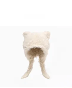 Detail of plush bear ear hat in cream white with soft faux fur texture and long earflaps