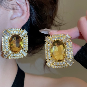 Close-up of vintage square amber crystal earrings with multi-layer pave rhinestones