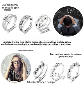 Detail of 6 piece set of stainless steel anxiety rings with rotatable beads for stress relief