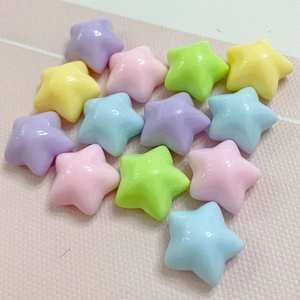 Close-up of assorted macaron colored resin star beads for DIY crafts and accessories