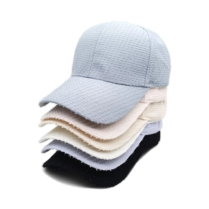 Women's glitter tweed baseball caps stacked in blue, pink, cream, grey and black colors