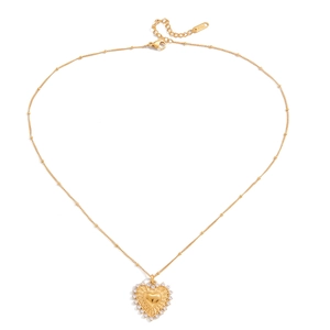 Macro shot of K18 hallmark on lobster clasp and golden beaded chain with crystals