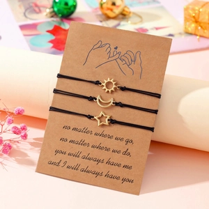 Detailed view of Sun Moon and Star woven friendship bracelets on Pinky Promise card
