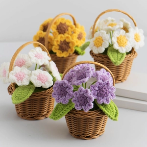 Handmade crochet sunflower and daisy mini potted plants in brown woven baskets