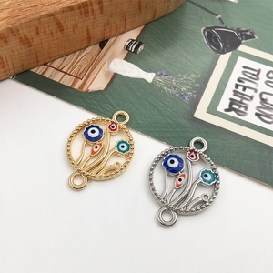 Detailed macro of gold and silver devil eye charms with enamel finish for jewelry making