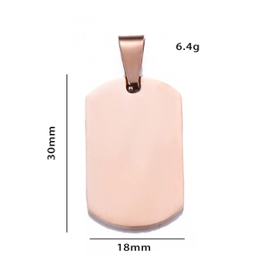 Detail view of rose gold dog tag pendant with 30mm x 18mm dimensions and 6.4g weight