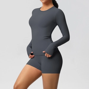 Close-up of deep grey yoga set fabric showing high-stretch material and matte texture