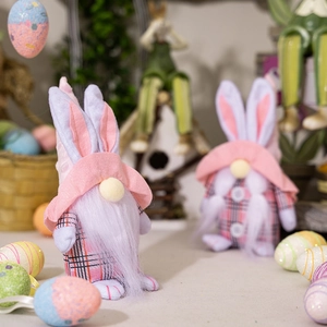 Detailed close-up of pink plaid Easter gnome plushies with long ears and fluffy beards