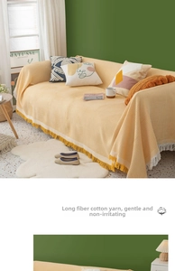 Close-up of yellow waffle texture blanket with long tassels made of long-fiber cotton