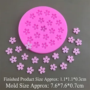 Pink silicone sakura mold with cherry blossom resin flower shapes for cake decorating