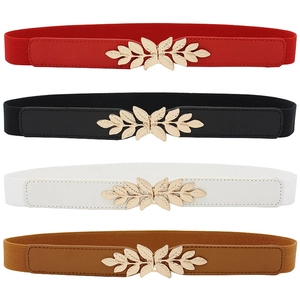 Detailed stack of elastic waist belts in four colors with golden leaf buckle on white background
