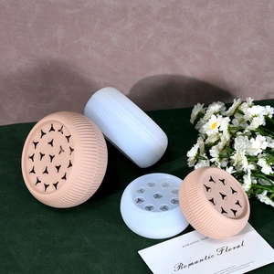 Detailed view of spiral silicone flower stem holder in pink and translucent white