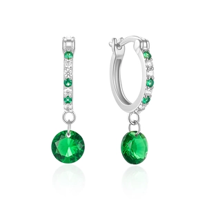 Macro shot of silver hoops featuring round emerald green gemstones and clear zircon accents