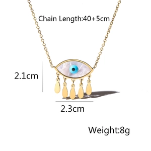 Detail view of gold Evil Eye fringe necklace with dimensions 2.1cm by 2.3cm and 45cm chain