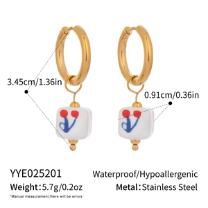 Detail view of enamel cherry earrings with stainless steel dimensions and weight specs