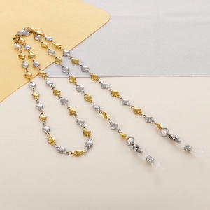 Detail of gold and silver titanium steel heart-shaped eyewear chain with silicone loops