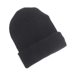 Classic black waffle knit beanie for winter featuring a minimalist fold-over cuff design