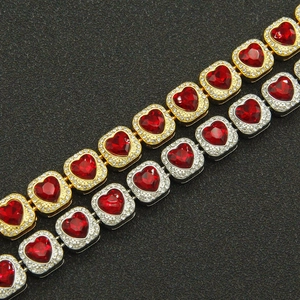 Hip hop heart bracelets in gold and silver with red rhinestones on black background