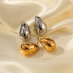 Chubby teardrop earrings in gold and silver finish with zircon inlays on champagne silk
