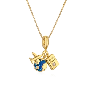 Gold travel necklace featuring plane, globe, and passport charms on a sleek chain