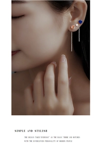 Close-up of S925 sterling silver earring set with colorful zircon tassels on model