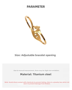 Detail of adjustable butterfly cuff bracelet in 18k gold titanium steel with zircon