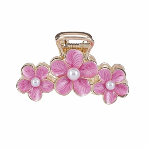Pink floral alloy hair claw clip with golden trim and pearl accents on white background