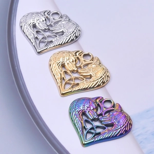 Detailed view of heart-shaped Celtic wolf pendants in silver, gold, and rainbow finish