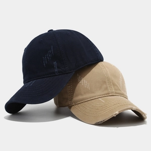 Navy blue and khaki washed cotton baseball caps with vintage distressed ripped details