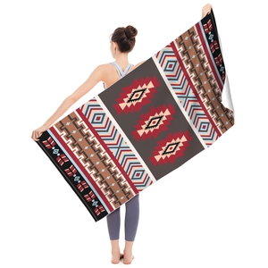 Macro detail of Aztec style microfiber beach towel with ethnic geometric patterns