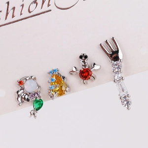 Close-up of little mermaid stud earrings set with colorful zircon stones on card