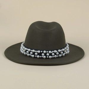 Detail of elegant fedora hat band featuring three rows of polished white pearls