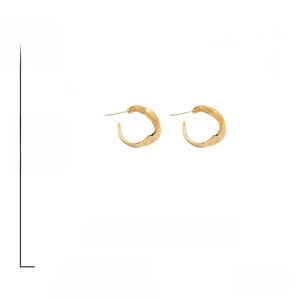 Detail of 2cm textured gold C-hoop earrings with 925 silver posts weighing 5.1g