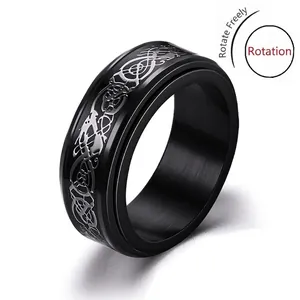 Men's titanium steel anxiety spinner ring with silver celtic dragon patterns on black band