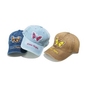 Vintage washed denim baseball caps with butterfly embroidery in blue and khaki colors