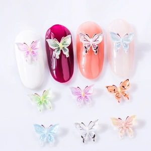 3D butterfly nail charms with colorful resin wings and glitter finish for nail art