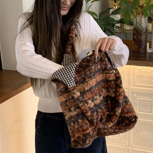 Close-up of bohemian knit tote bag showing the soft texture and large interior capacity