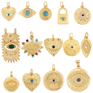 Golden Evil Eye charms in various shapes including heart and round with colorful stones