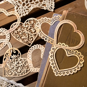 Vintage heart lace paper pack for scrapbooking decoration on retro wooden background