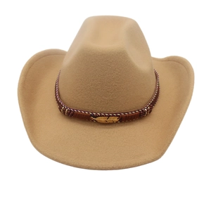 Detail of western cowboy hat featuring woven band and vintage gold feather metal buckle