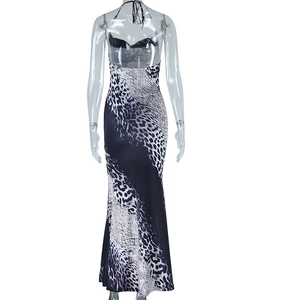 Detail of snake print bodycon dress with halter neck and backless design on mannequin