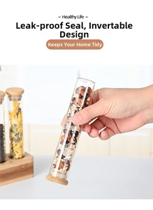 Leak-proof glass storage tube with airtight wood lid shown inverted with nuts inside