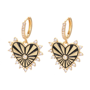 Golden heart drop earrings with black enamel sunburst pattern and clear crystals