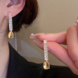 Boucles d'oreilles pendantes dorées avec cristaux et pierres ambrées en forme de larme