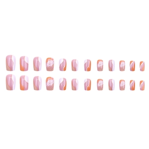 Short press-on nails set with orange abstract wavy lines and tiger stripe patterns