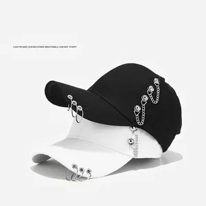 Punk style baseball caps with metal rings and chains in black and white colors