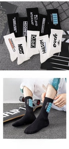 Detail of crew socks with creative battery icons and typography on ribbed cotton fabric
